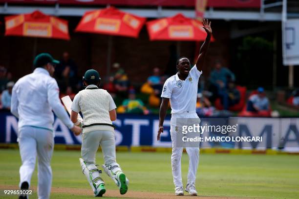 South Africa bowler Kagiso Rabada celebrates taking the wicket of Shaun Marsh during day one of the second Sunfoil Test between South Africa and...