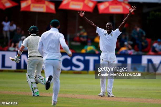 South Africa bowler Kagiso Rabada celebrates taking the wicket of Shaun Marsh during day one of the second Sunfoil Test between South Africa and...