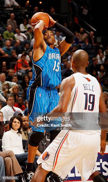 Vince Carter of the Orlando Magic shoots a long jump shot against Raja Bell of the Charlotte Bobcats on November 10, 2009 at the Time Warner Cable...