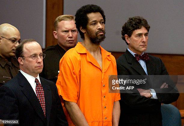This March 9, 2004 file photo shows convicted sniper John Allen Muhammad standing emotionless with attorney Peter Greenspun and Jonathan Shapiro as...