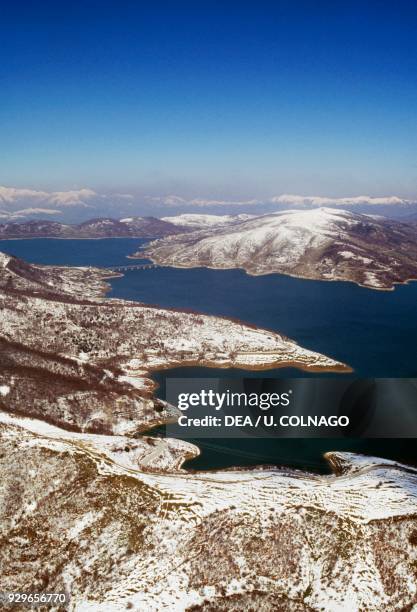 Aerial view of Lake Campotosto, snowy landscape, Gran Sasso and Monti della Laga National Park, Abruzzo, Italy.