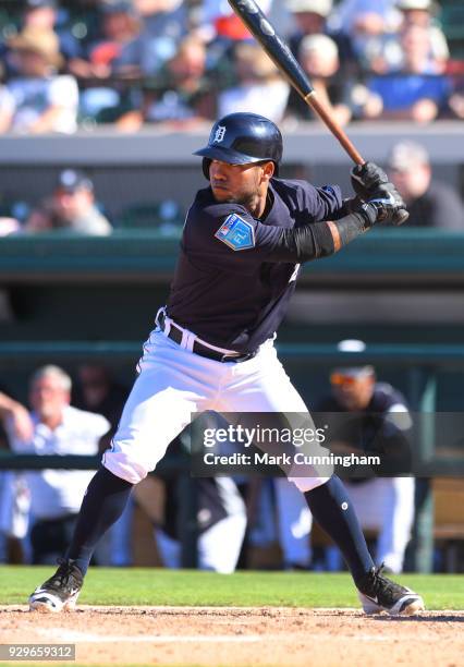Alexi Amarista of the Detroit Tigers bats during the Spring Training game against the Tampa Bay Rays at Publix Field at Joker Marchant Stadium on...
