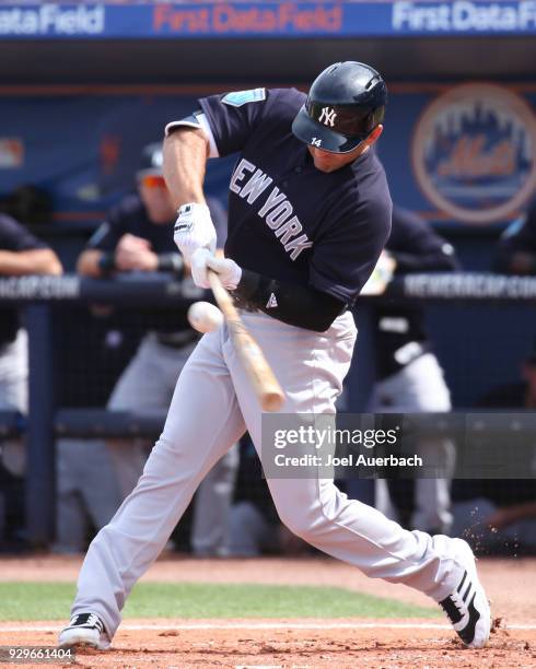 Danny Espinosa of the New York Yankees hits the ball against the New York Mets during a spring training game at First Data Field on March 7, 2018 in...