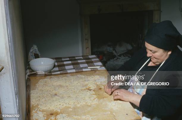 Woman preparing fresh pasta, Montefalcone del Sannio, Molise, Italy.