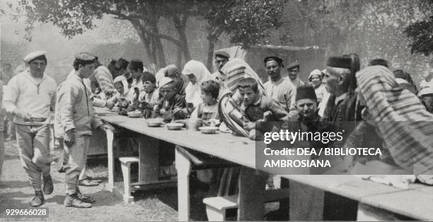 Italian and Austrian sailors distributing soup to the poor, Albania, photograph by Aldo Molinari, from L'Illustrazione Italiana, Year XL, No 23, June...