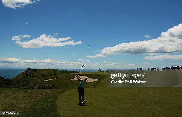 Sean O'Hair of the USA plays an approach shot on the 10th hole during the first round of The Kiwi Challenge at Cape Kidnappers on November 11, 2009...