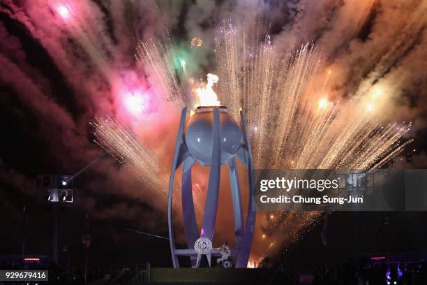 Fireworks explodes as Seo Soonseok and Kim EunJung light the Paralympic cauldron during the opening ceremony of the PyeongChang 2018 Paralympic Games...