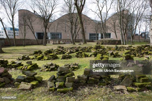 Mueseum Judengasse in Frankfurt/Main - memorial Neuer Börneplatz. Grave stones on the old Jewish cementary. In the background the building of the...