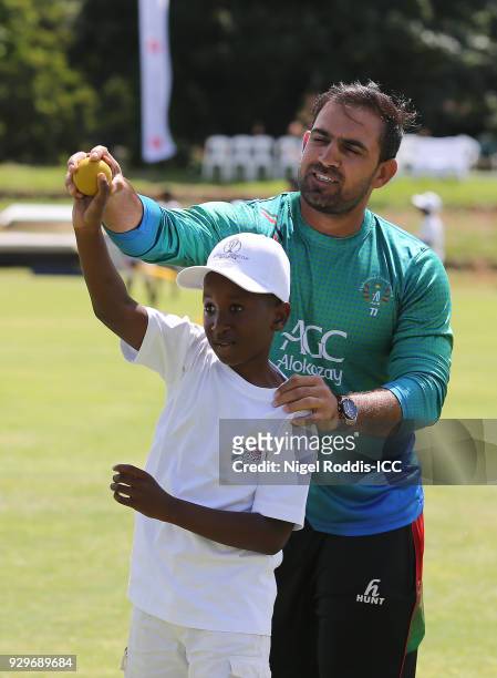 Samiullah Shenwari of Afghanistan coaching local children during the Afghanistan Cricket for Good session during the ICC Cricket World Cup Qualifier...