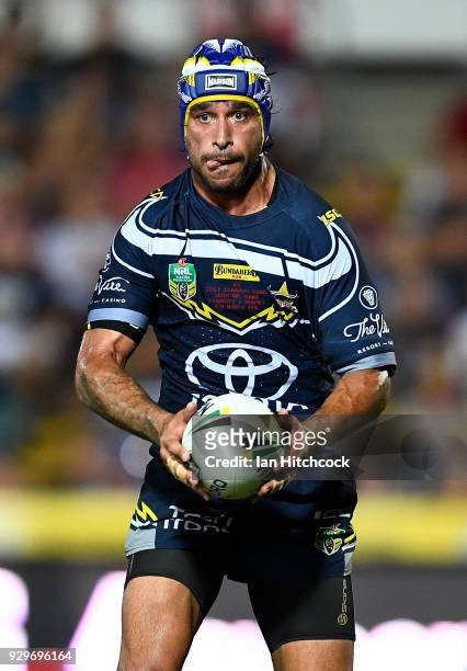 Johnathan Thurston of the Cowboys runs the ball during the round one NRL match between the North Queensland Cowboys and the Cronulla Sharks at...