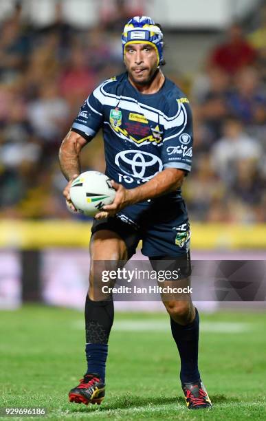 Johnathan Thurston of the Cowboys runs the ball during the round one NRL match between the North Queensland Cowboys and the Cronulla Sharks at...