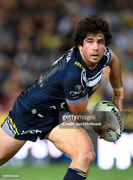 Jake Granville of the Cowboys looks to pass the ball during the round one NRL match between the North Queensland Cowboys and the Cronulla Sharks at...