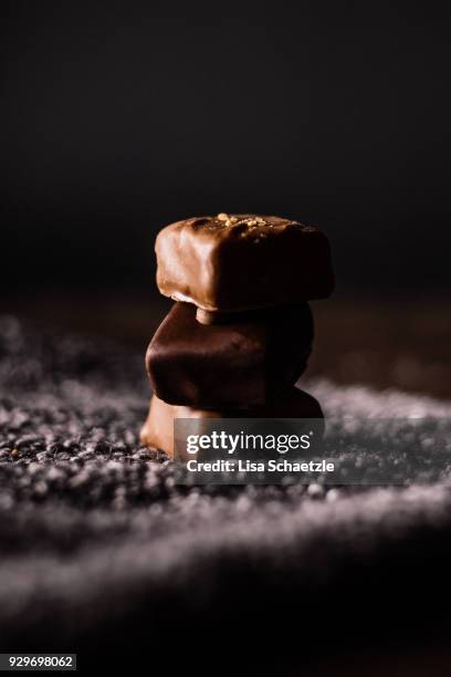 stacked chocolate pralines - close up of chocolates for sale stock pictures, royalty-free photos & images