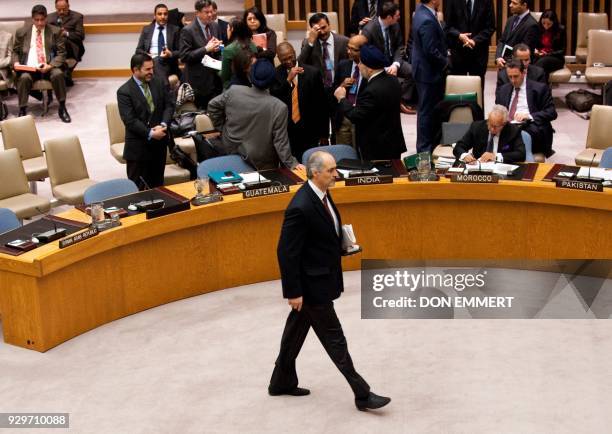 Syria's Ambassador to the UN Bashar al-Ja'fari on the floor before a vote on a resolution on Syria in the United Nations Security Council during a...