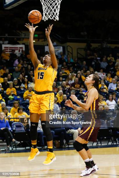 Toledo Rockets center Kaayla McIntyre goes in for a layup during a regular season Mid-American Conference game between the Central Michigan Chippewas...