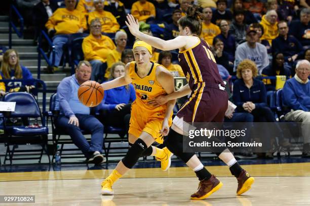 Toledo Rockets guard Mariella Santucci drives to the basket against Central Michigan Chippewas guard Cassie Breen during a regular season...