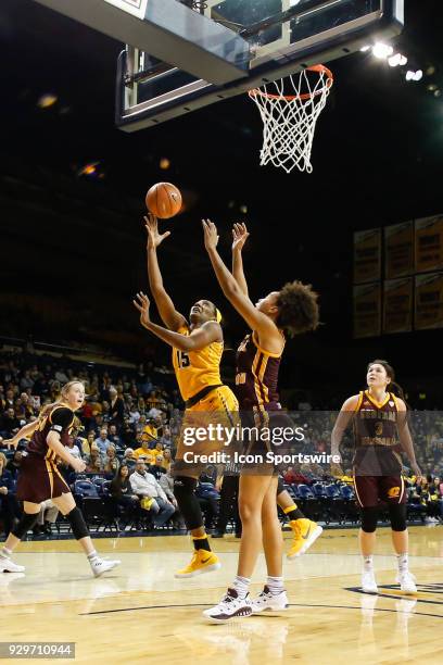 Toledo Rockets center Kaayla McIntyre puts up a shot against Central Michigan Chippewas forward Tinara Moore during a regular season Mid-American...