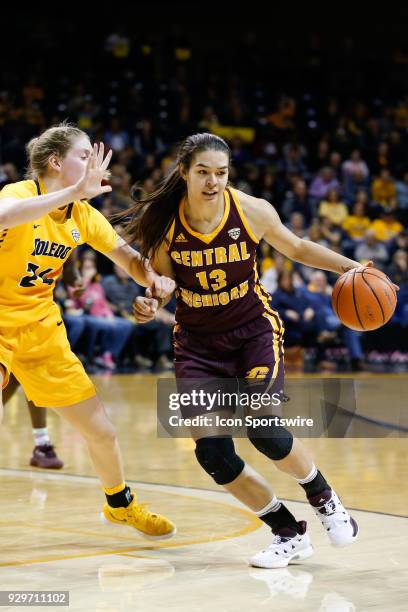 Central Michigan Chippewas forward Reyna Frost drives to the basket against Toledo Rockets forward Michaela Rasmussen during a regular season...