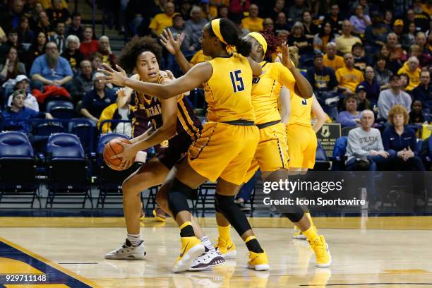 Central Michigan Chippewas forward Tinara Moore looks to pass the ball while being defended by Toledo Rockets center Kaayla McIntyre during a regular...