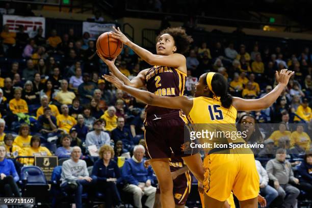 Central Michigan Chippewas forward Tinara Moore goes in for a layup against Toledo Rockets center Kaayla McIntyre during a regular season...