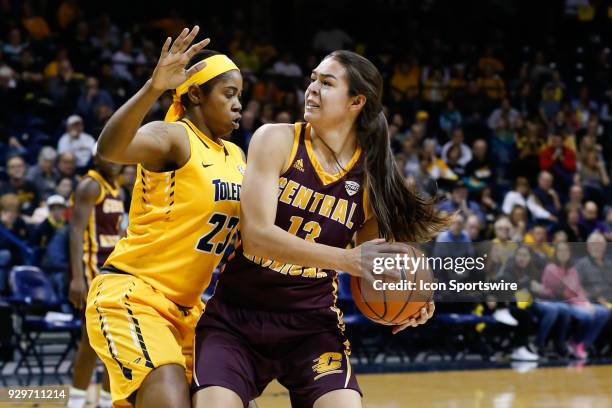 Central Michigan Chippewas forward Reyna Frost looks to post up against Toledo Rockets forward Tanaya Beacham during a regular season Mid-American...