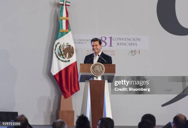 Enrique Pena Nieto, Mexico's president, smiles during the Banks of Mexico Association Annual Banking Convention in Acapulco, Mexico, on Thursday,...