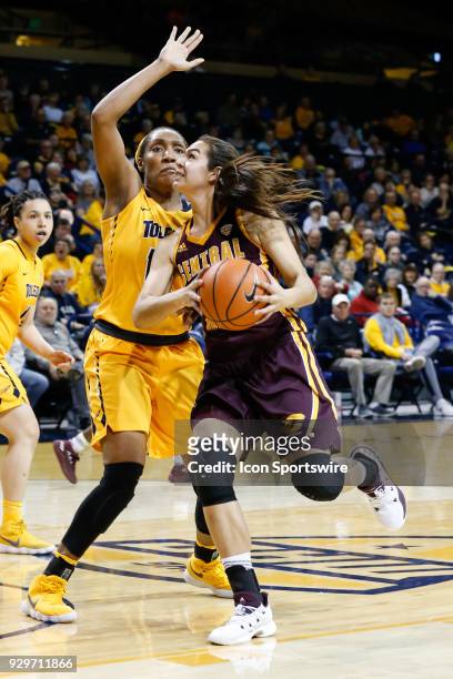 Central Michigan Chippewas forward Reyna Frost drives to the basket against Toledo Rockets center Kaayla McIntyre during a regular season...