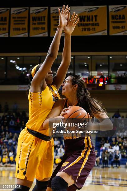 Central Michigan Chippewas forward Reyna Frost looks to shoot against Toledo Rockets center Kaayla McIntyre during a regular season Mid-American...