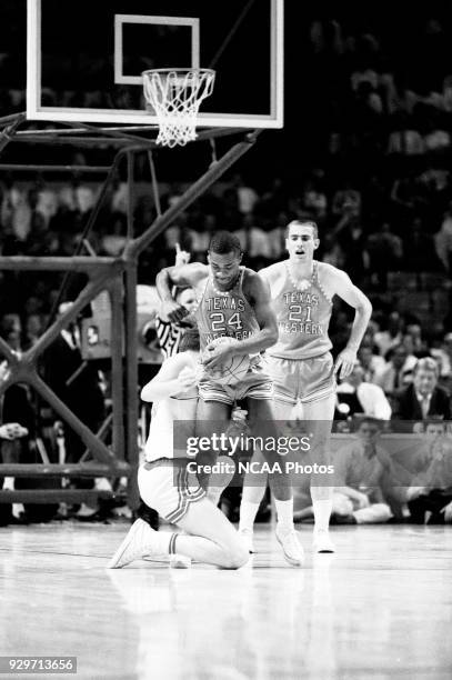 Willie Worsley of Texas Western fights for a loose ball against Utah during the semifinals game game in the 1966 NCAA Photos via Getty Images Men's...