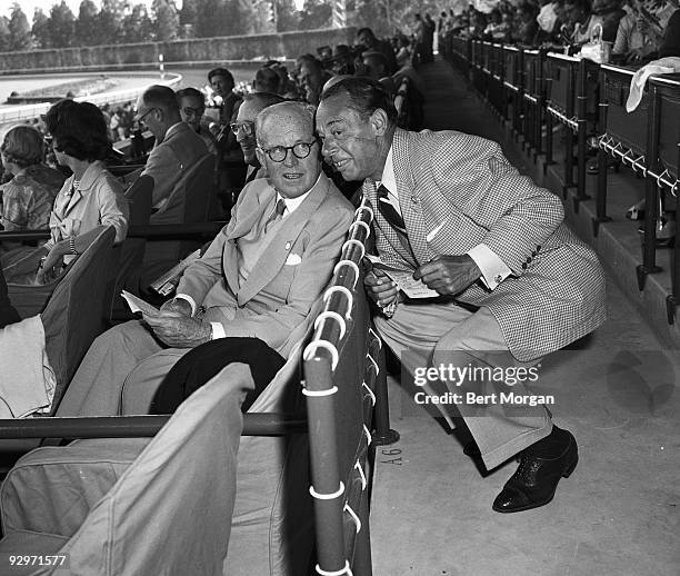 Hon. Joseph P. Kennedy and Joe E Lewis talking in the stands at the Hialeah Race Course, Hialeah, Florida, January, 1954