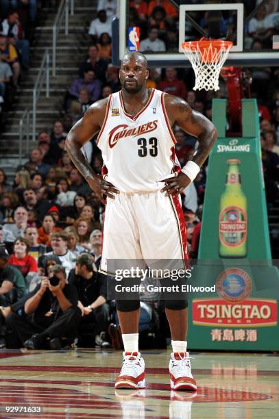 Shaquille O'Neal of the Cleveland Cavaliers stands in the back court waiting for play to resume during the game against the Charlotte Bobcats at...