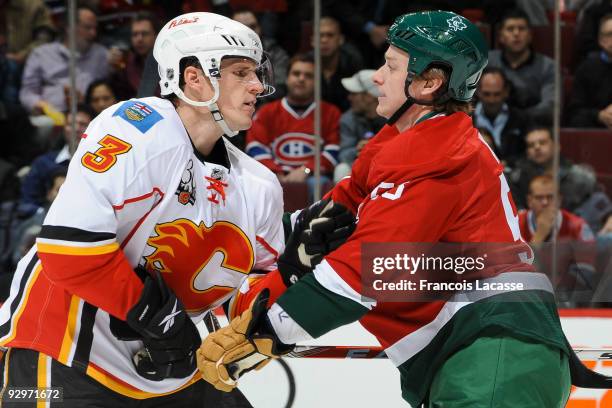 Dion Phaneuf of the Calgary Flames and Ryan White of the Montreal Canadiens tangle in NHL action on November 10, 2009 at the Bell Centre in Montreal,...