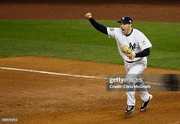 Mark Teixeira of the New York Yankees celebrates after the final out of the Yankees' 7-3 win against the Philadelphia Phillies in Game Six of the...