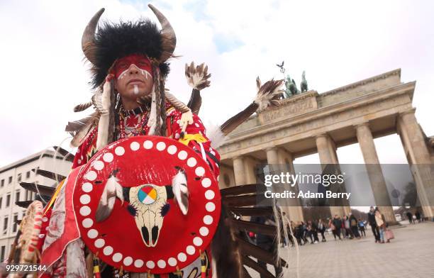 Indigenous Dancer and Drummer Bryce Morison poses while performing with the Calgary Stampede at the Brandenburg Gate as the group visits Germany to...