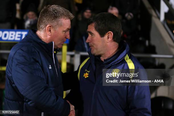 Brentford manager Dean Smith and Burton Albion manager Nigel Clough during the Sky Bet Championship match between Burton Albion and Brentford the at...