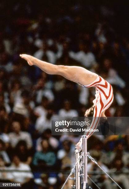 Mary Lou Retton of the USA performs on the uneven parallel bars during the Women's Gymnastics competition of the 1984 Summer Olympic Games held from...