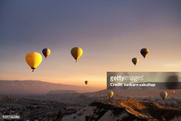 hot air balloons over cappadocia. - hot air balloon basket stock pictures, royalty-free photos & images