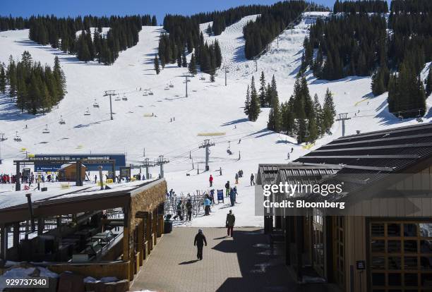 Skiers come down the mountain at a Vail Resorts Inc. Location in Vail, Colorado, U.S., on Thursday, March 8, 2018. Trading in shares of Vail Resorts...