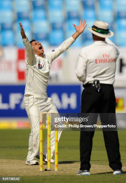 Saeed Ajmal of Pakistan celebrates after taking his fifth wicket of the innings, England's Stuart Broad LBW for 8, during the 1st Test match between...