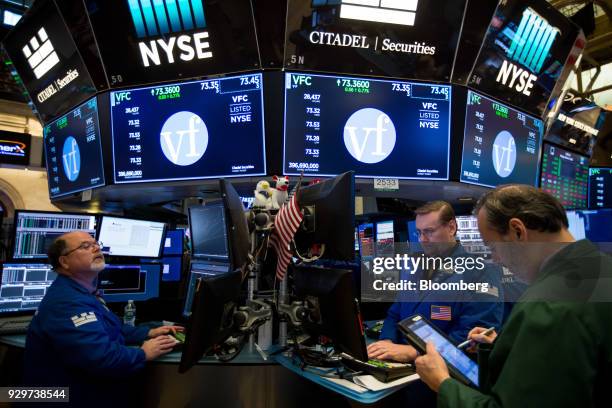 Traders work on the floor of the New York Stock Exchange in New York, U.S., on Friday, March 9, 2018. U.S. Stocks rose while Treasuries fell as the...