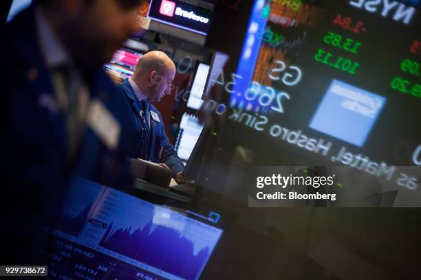 Trader works on the floor of the New York Stock Exchange in New York, U.S., on Friday, March 9, 2018. U.S. Stocks rose while Treasuries fell as the...