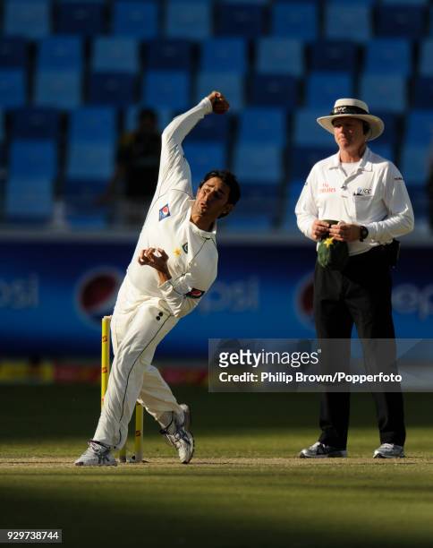 Saeed Ajmal bowling for Pakistan during the 1st Test match between Pakistan and England at Dubai Sports City Stadium, Dubai, 19th January 2012. The...