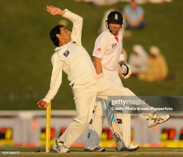 Saeed Ajmal of Pakistan bowls past England batsman Ian Bell Saeed Ajmal of Pakistan bowls past England batsman Ian Bell during the 2nd Test match...