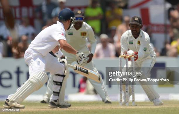 England batsman Jonathan Trott is stumped by Sri Lanka wicketkeeper Prasanna Jayawardene for 12 runs during the 1st Test match between Sri Lanka and...