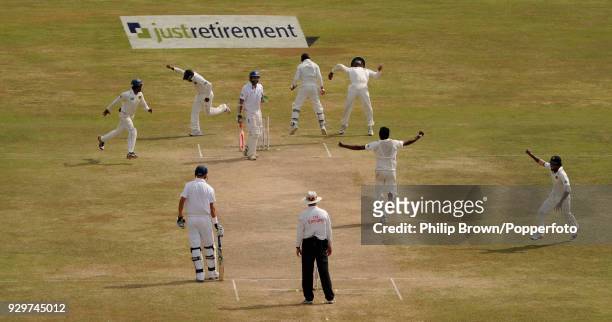 Sri Lanka players celebrate after taking the final England wicket, Monty Panesar caught by Sri Lanka's Tillakaratne Dilshan off the bowling of Suraj...