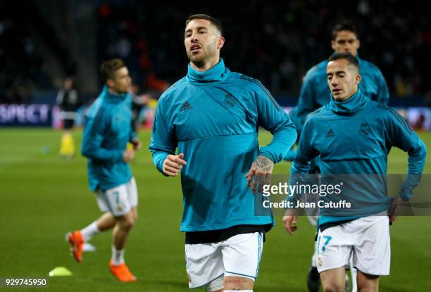 Sergio Ramos, Lucas Vazquez of Real Madrid warm up prior to the UEFA Champions League Round of 16 Second Leg match between Paris Saint-Germain and...