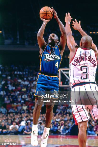 Joe Dumars of the Detroit Pistons shoots circa 1997 at the Compaq Center in Houston, Texas. NOTE TO USER: User expressly acknowledges and agrees...