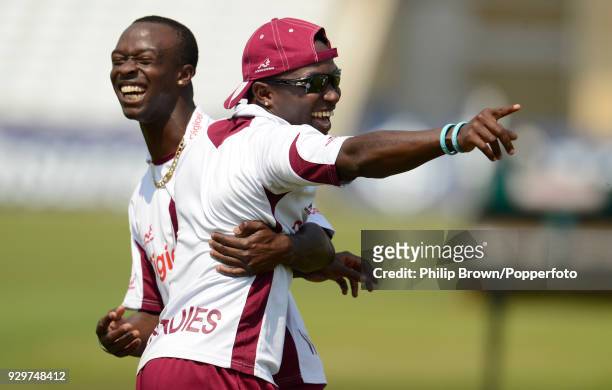 West Indies bowlers Kemar Roach and Fidel Edwards share a joke during a training session before the 2nd Test match between England and West indies at...