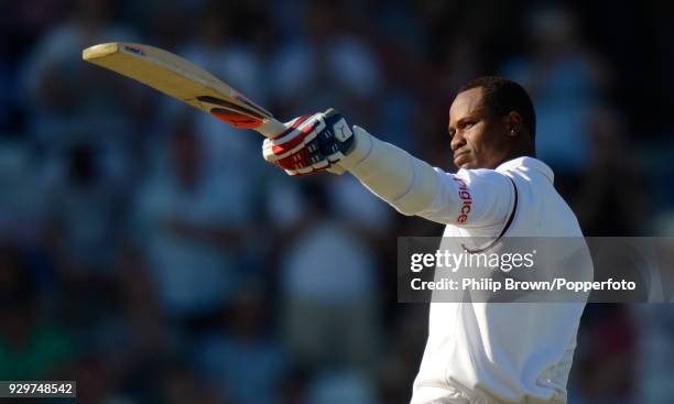 West Indies batsman Marlon Samuels celebrates reaching his century during his innings of 117 in the 2nd Test match between England and West indies at...