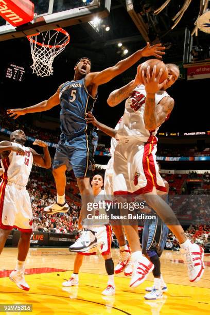 Michael Beasley of the Miami Heat grabs a rebound against Dominic McGuire of the Washington Wizards on November 10, 2009 at American Airlines Arena...